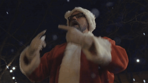 Dave Synder dressed as Santa whistling