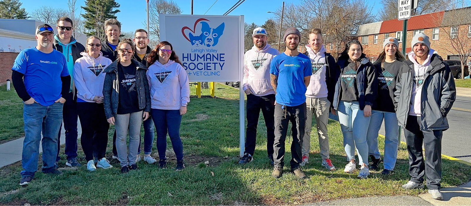 image description: group of people in front of Lehigh Valley Humane Society sign