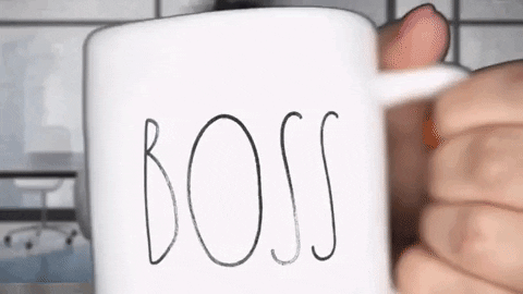 gif of mom holding up a coffee cup that say Boss and then drinking out of it